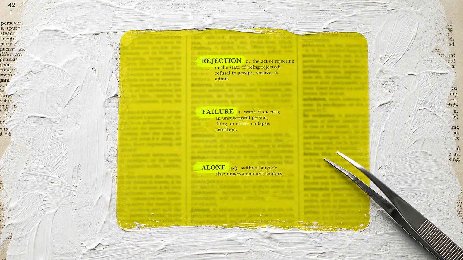 A yellow filter over a page of text that only reveals negative words like 'Rejection' and 'Failure'.
