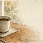 An ink and watercolor illustration of a morning coffee cup on a wooden table with a gentle ripple, symbolizing subtle early changes.
